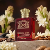 Maison Amir perfume bottle with decorative elements on a surface with flowers and almonds.